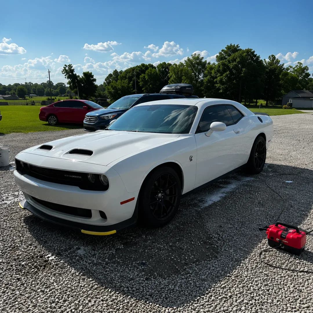 White Dodge Challenger Hellcat detailed and shining