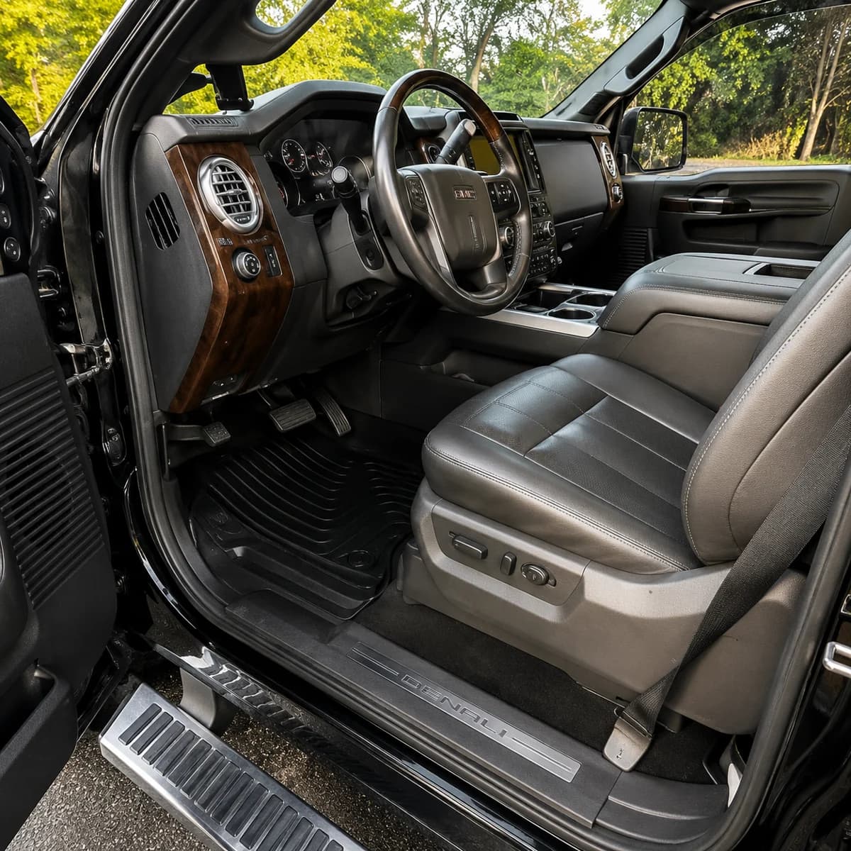 GMC Denali interior after a full detail — spotless mats and conditioned leather